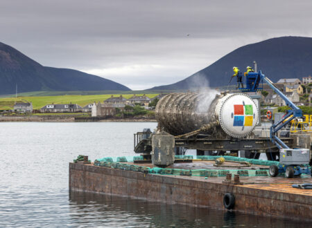 An underwater data center module installed on the seabed off Japan's coast, connected via fiber-optic and power lines with natural cooling from surrounding sea water.