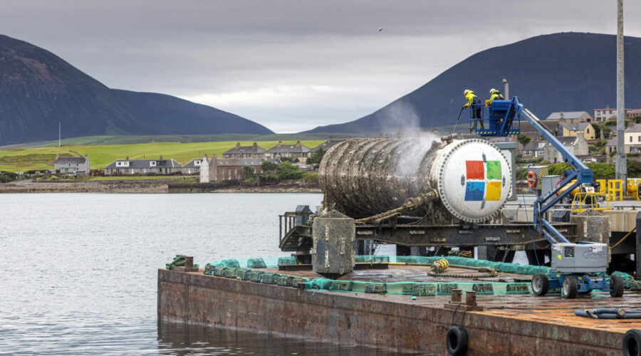 An underwater data center module installed on the seabed off Japan's coast, connected via fiber-optic and power lines with natural cooling from surrounding sea water.