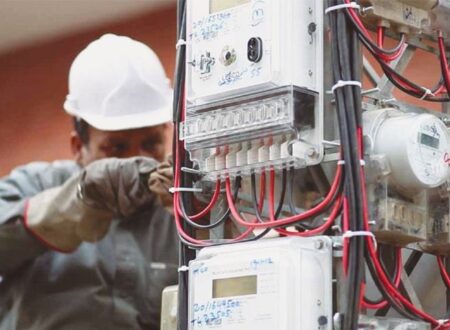WAPDA engineers installing a smart electricity meter on a residential/commercial building in Lahore under the anti-theft initiative.