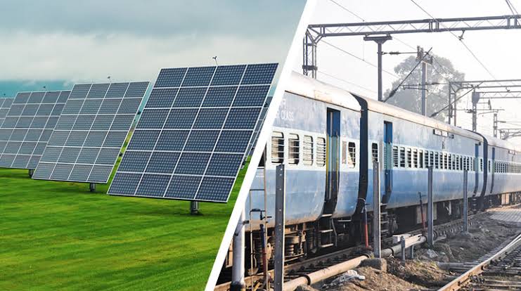 Pakistan Railways eco‑friendly train coach with solar panels on the roof, operating at a major station like Lahore Junction, illuminated by solar‑powered LEDs.